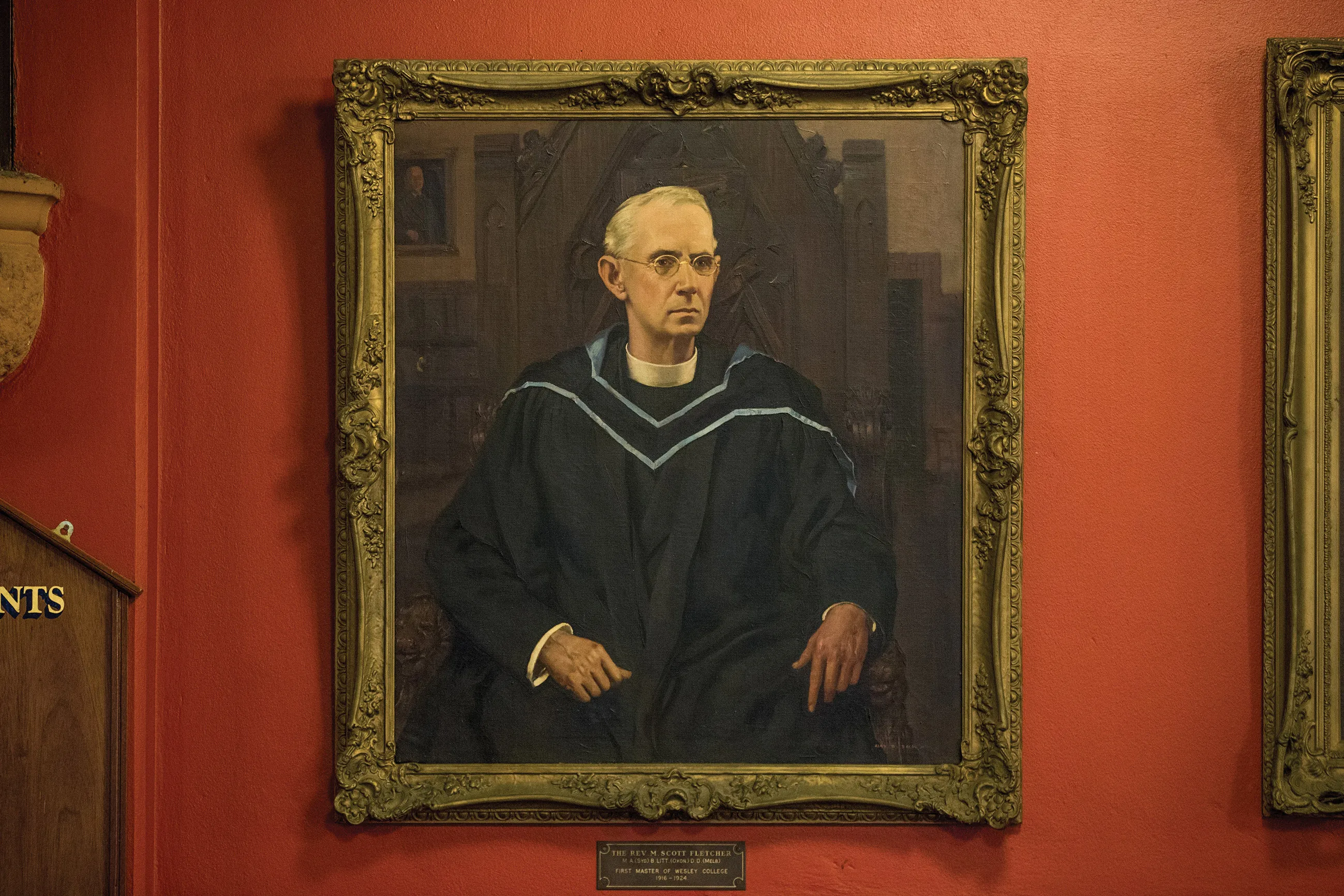 Oil portrait of a serious man wearing academic robes and glasses, seated in an ornate chair against a dark background.