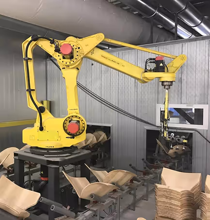 A machine that is working on some chairs.