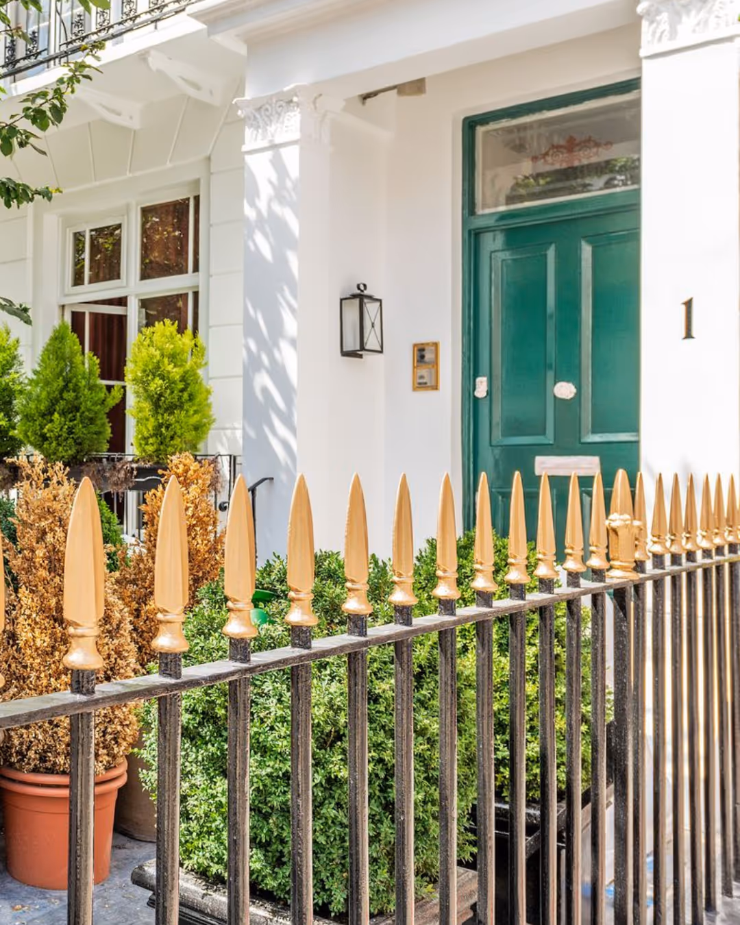 Timber door and decorative railings restored as part of exterior painting project in Chelsea