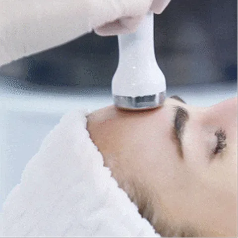 A man getting his hair cut by a hair stylist.