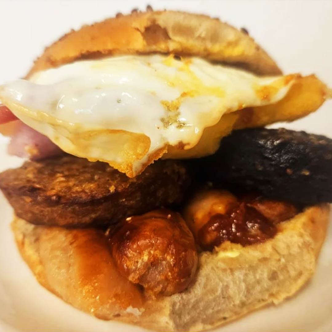 Our famous breakfast bap with Egg, Pudding, and sausage