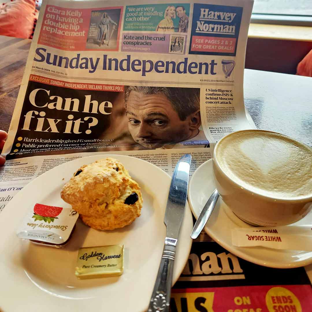 A coffee and scone at Roots Cafe with a Sunday newspaper to read