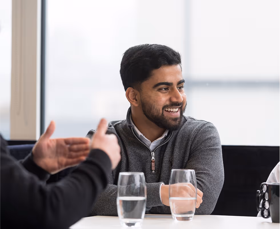 Langham Hall employee in a meeting