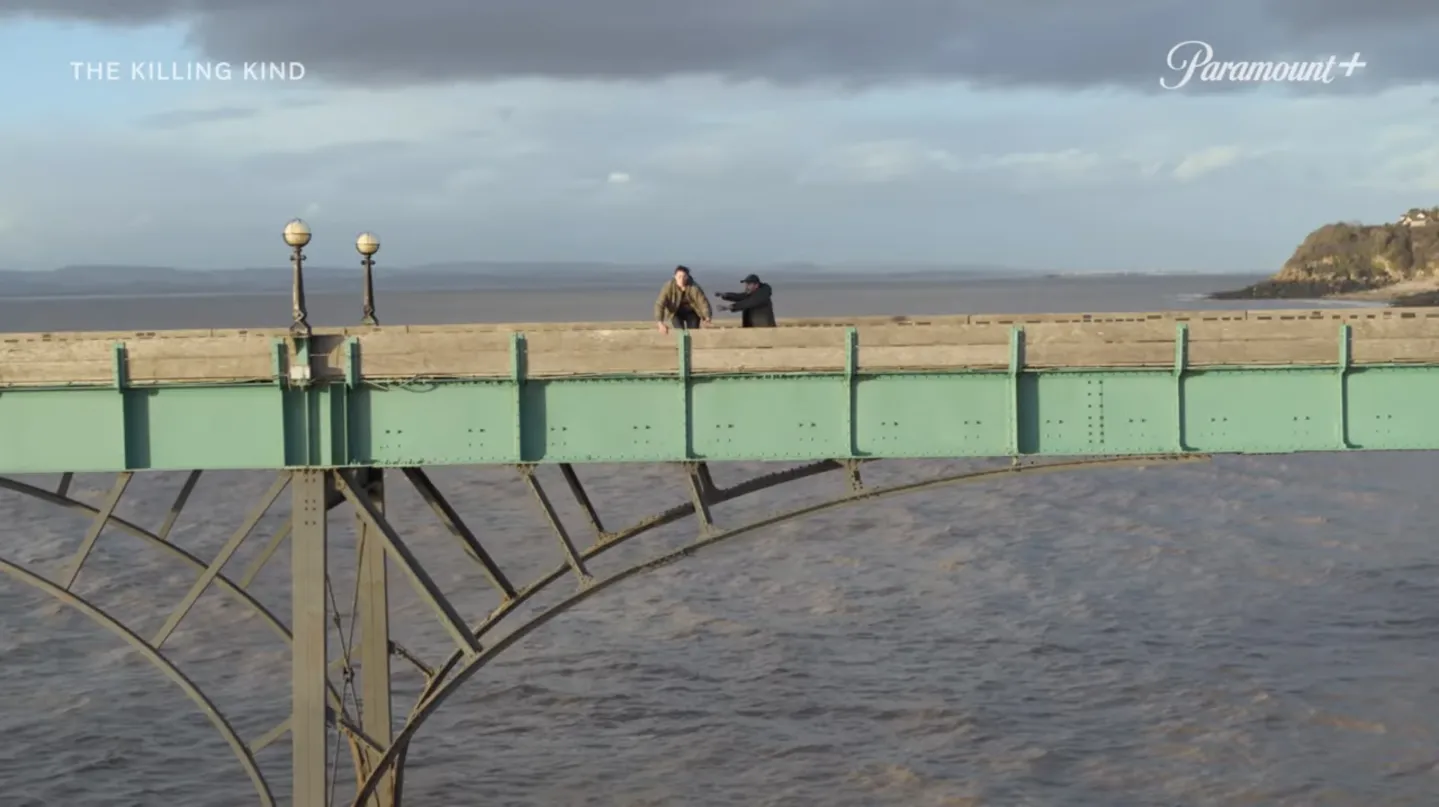 killing kind still of men on bridge