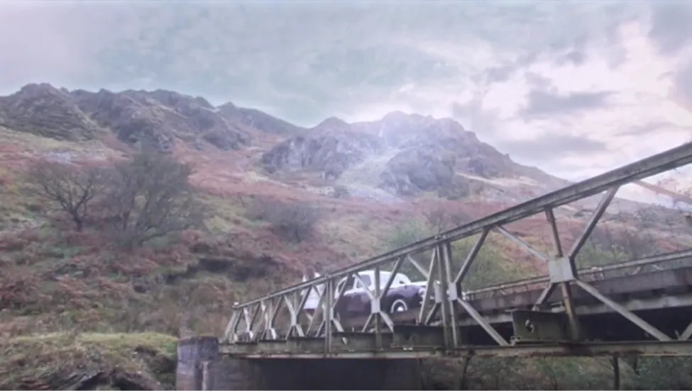 Pantalar Un still of vintage car on bridge