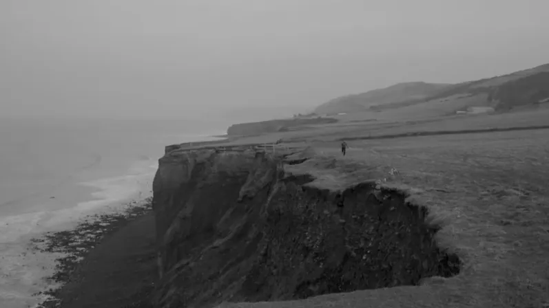 Hinterland still of man running on top of coast