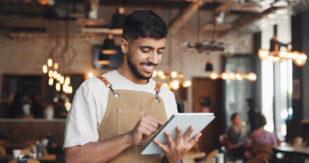 An employee using table for restaurant reservation system