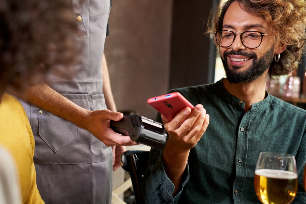 A customer making contactless payment