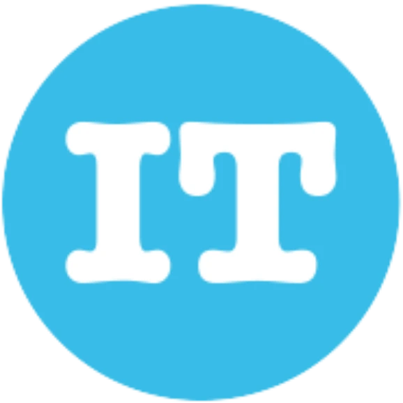 A woman in a black jacket is looking at the camera.