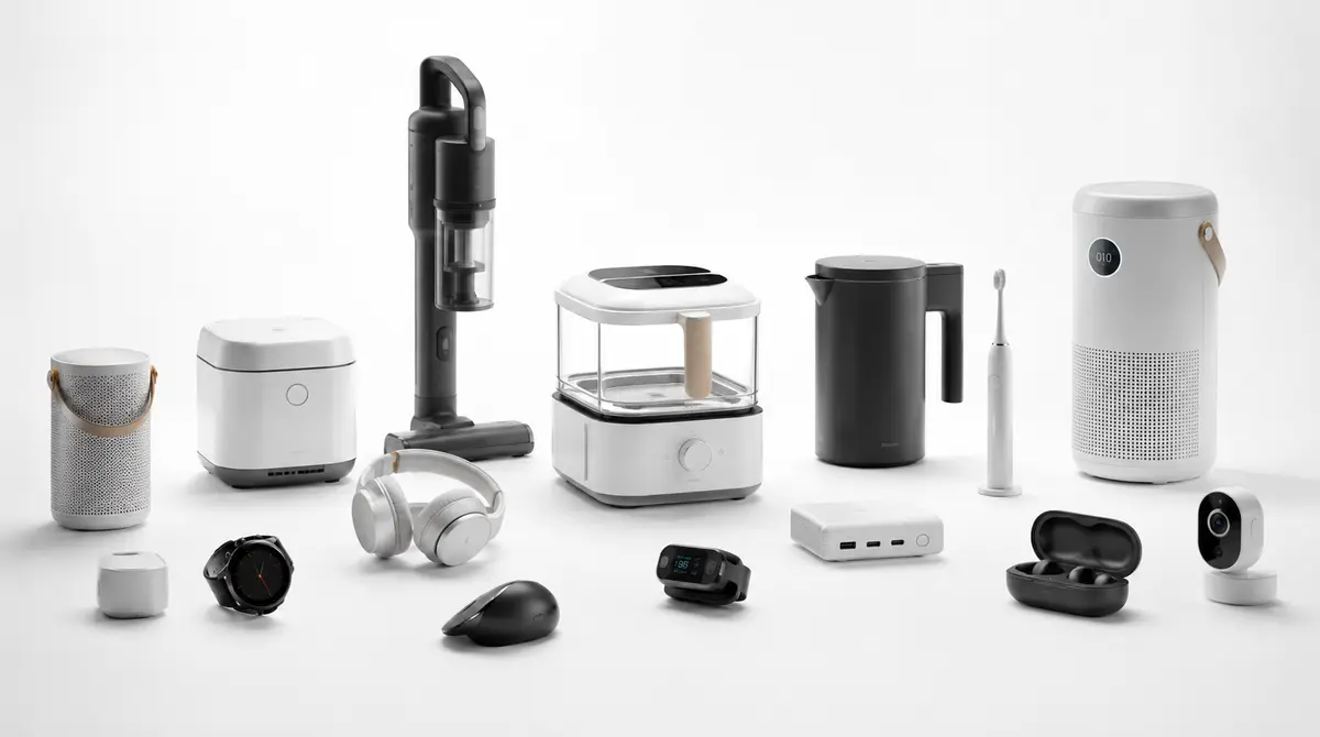 Collection of minimalist consumer products — cordless vacuum, electric kettle, headphones, smartwatch, earbuds, air purifier, and smart home devices — representing the range of work from full-service design and development agencies