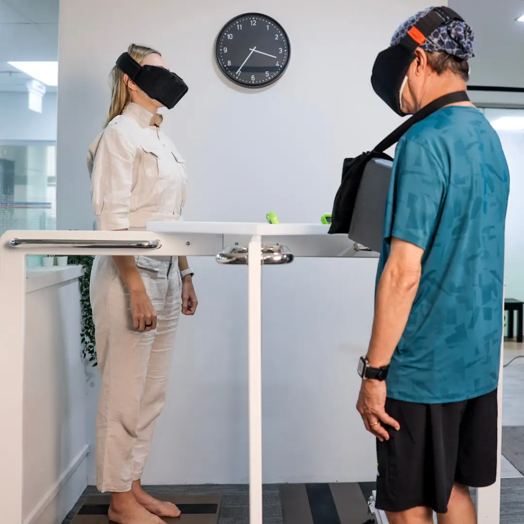 Two patients undergoing specialized balance, weight, and posture recalibration rehabilitation at Dr. Will's structural chiropractic center in Singapore