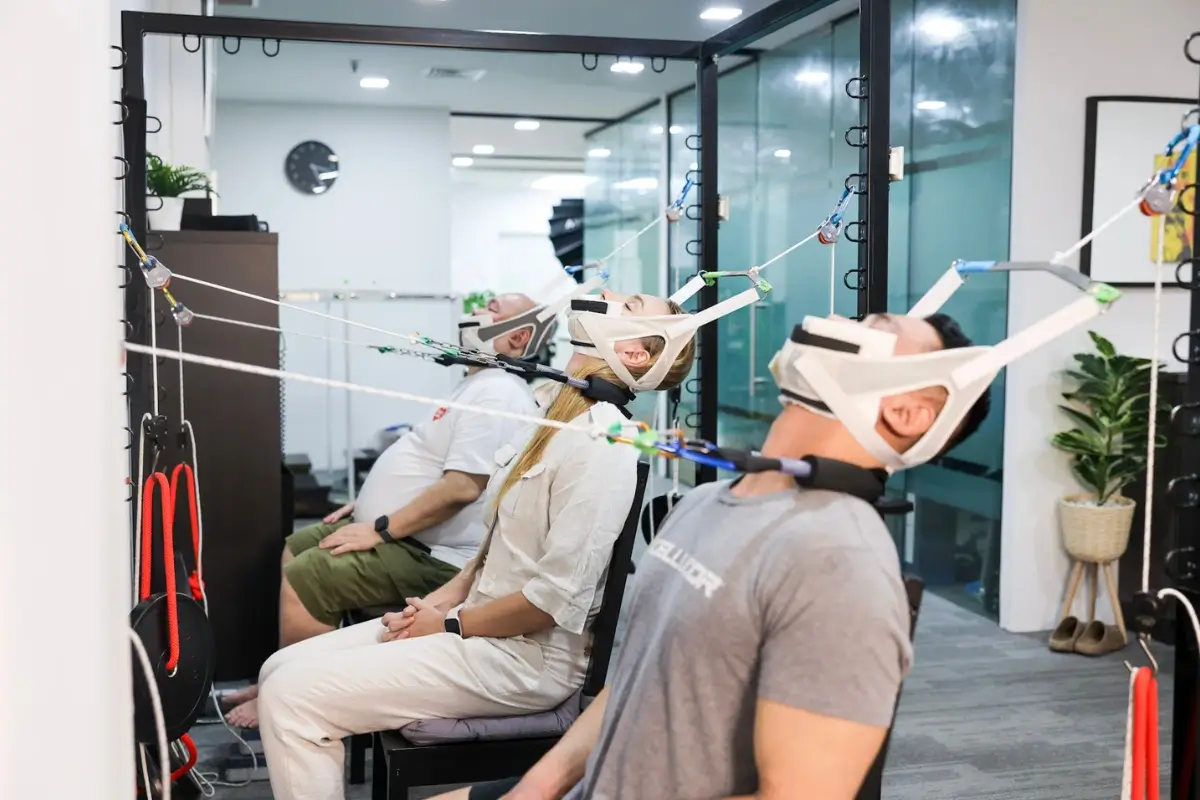 Patients undergoing targeted cervical spine traction sessions to release deep neck restrictions and stiffness.