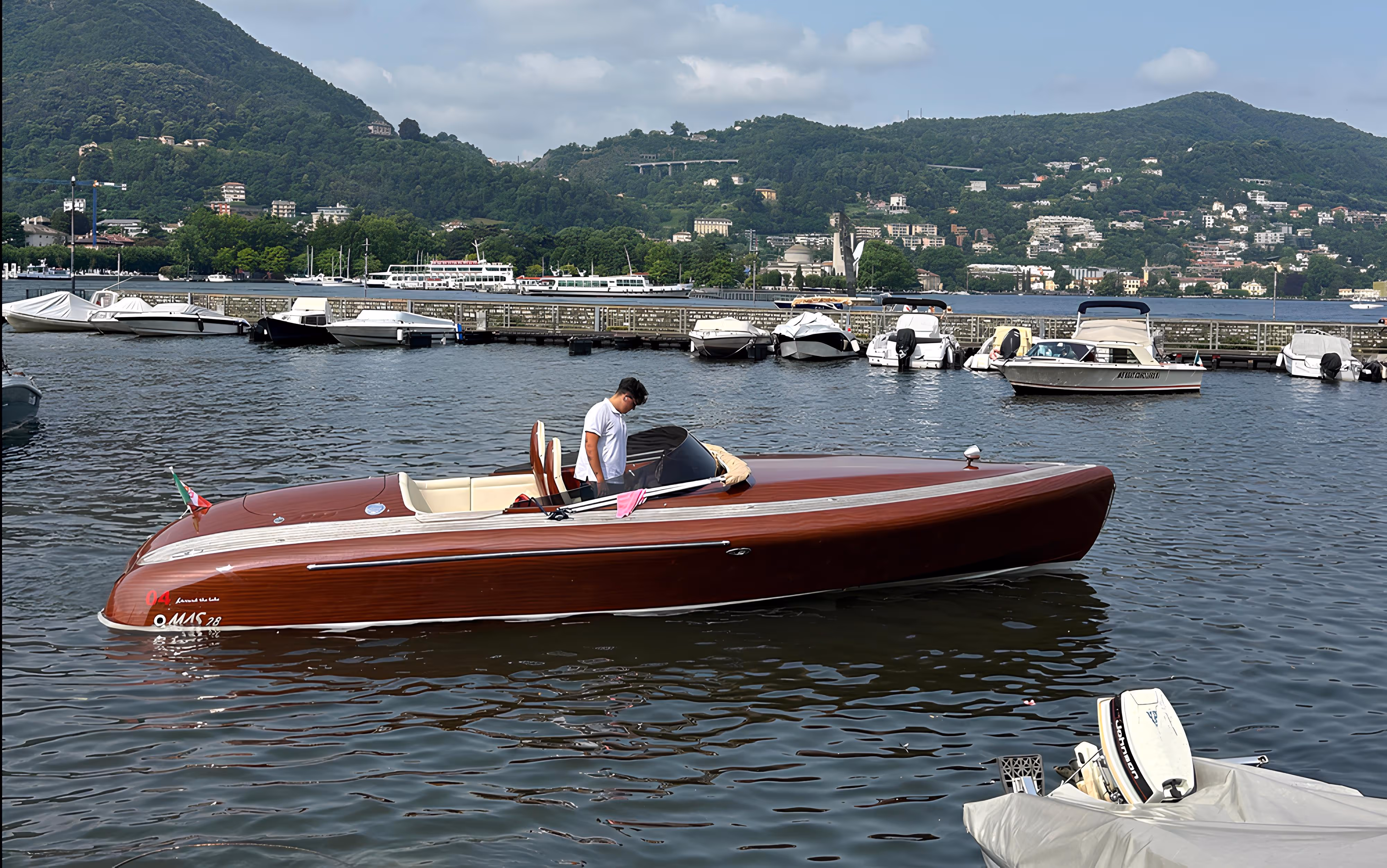Private and sharing boat tours on lake Como, Italy. Modern style mass boat