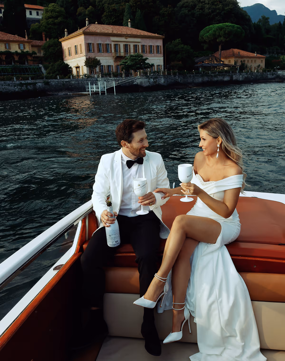 Wedding photoshoot on a wooden boat on Lake Como, Italy