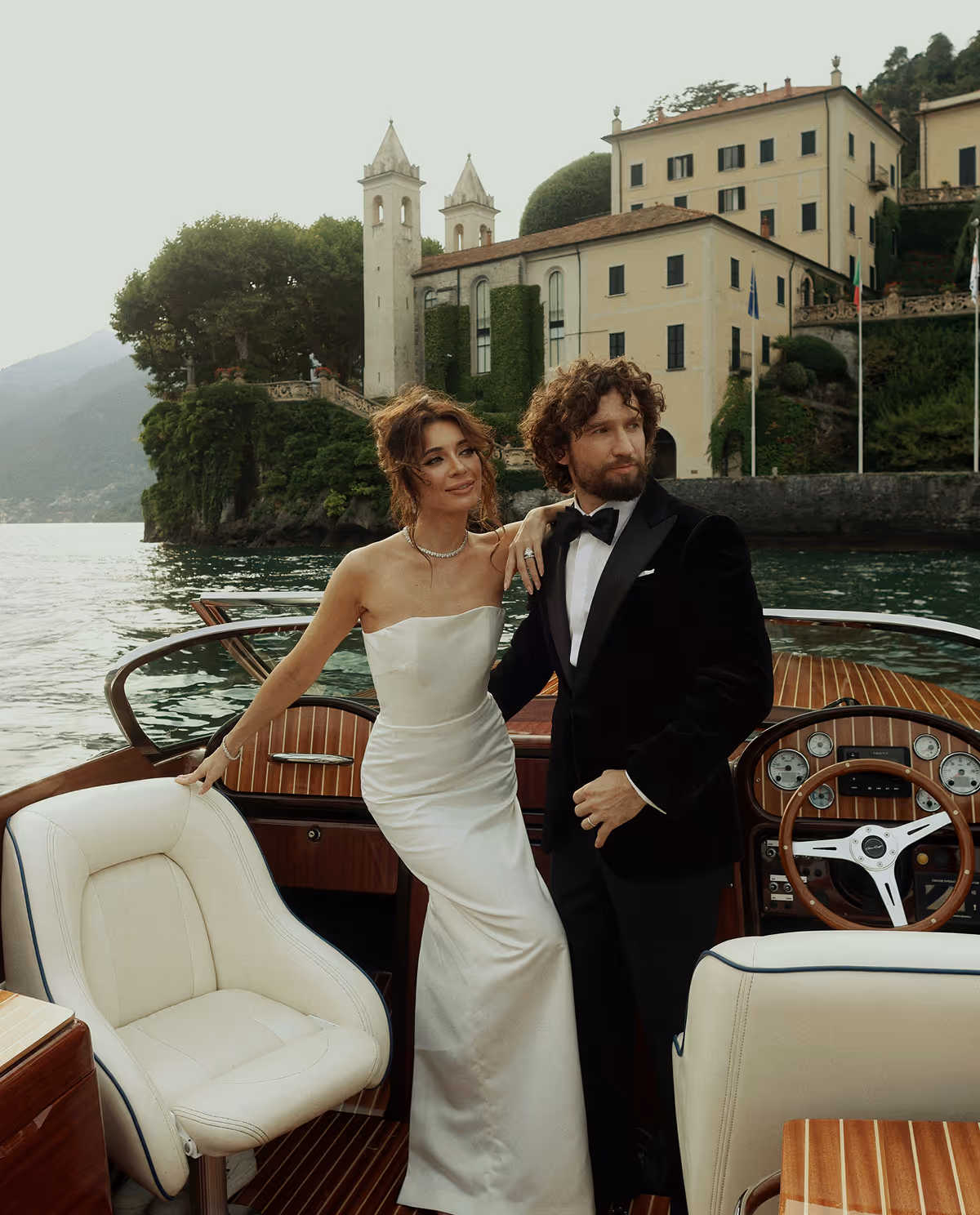 Wedding photoshoot on a wooden boat on Lake Como, Italy