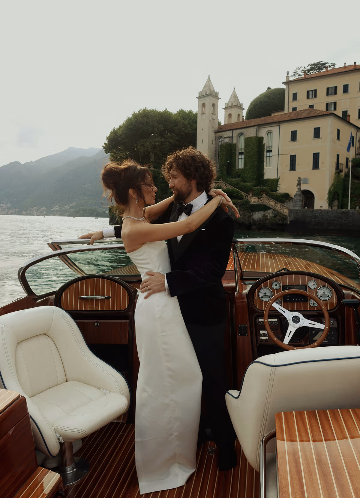 Wedding photoshoot on a wooden boat on Lake Como, Italy