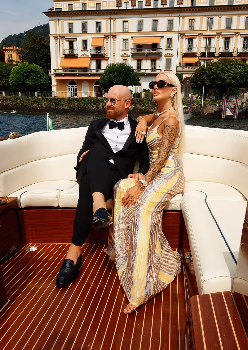Romantic photo shoot on a wooden boat on Lake Como, Italy