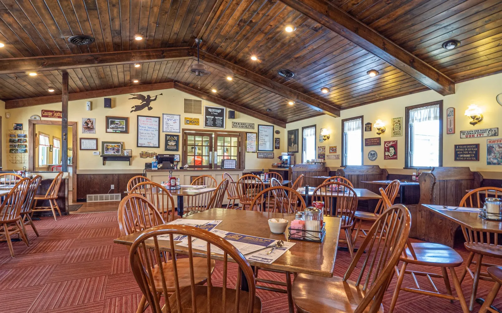 Brown's Country Kitchen main hall featuring wooden tables and chairs arranged for dining.