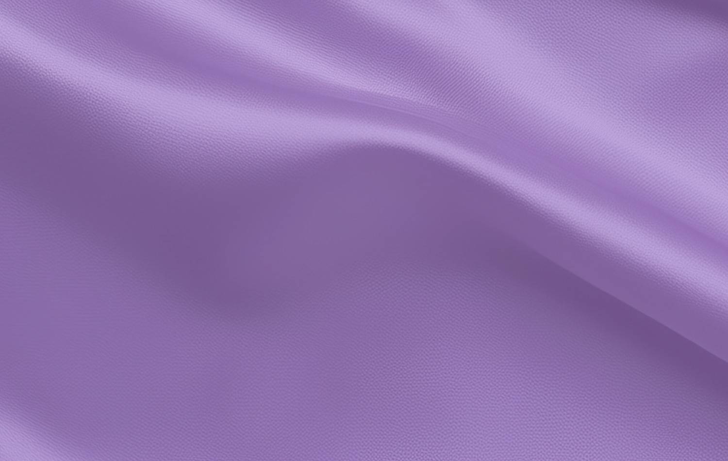 Smooth lavender purple fabric with gentle folds and a slightly textured surface.