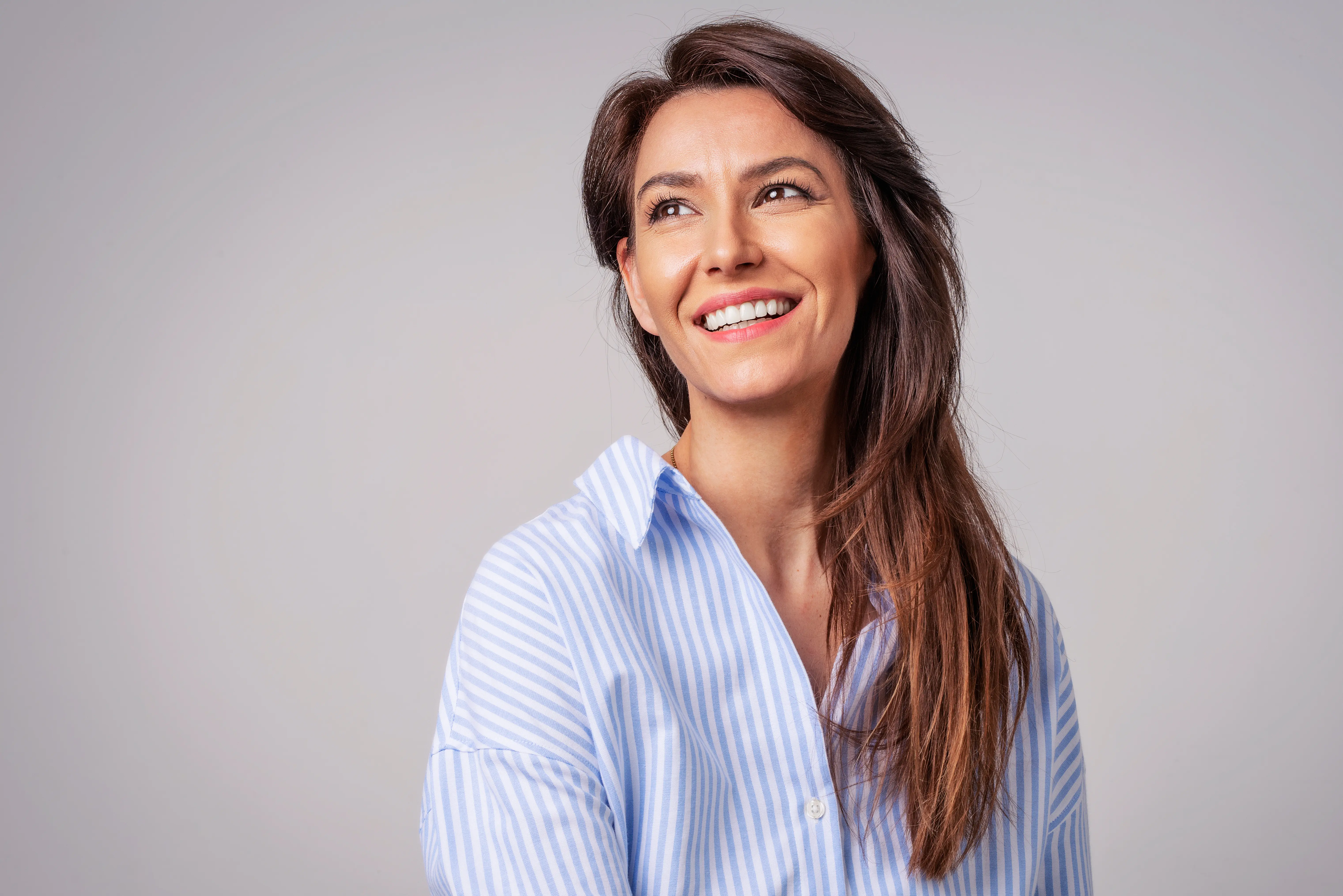 A woman with a smile on her face.