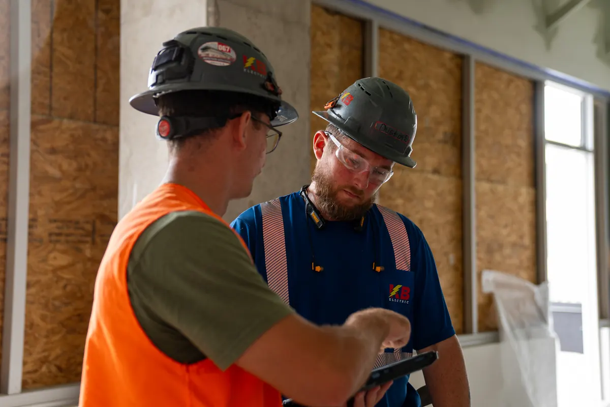 KB Electric service team reviewing a work order on site
