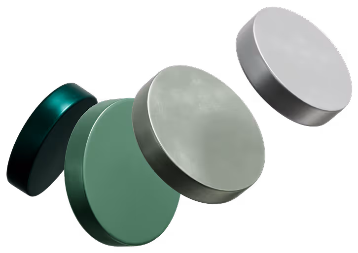 Five floating circular discs in various metallic and green shades against a black background.
