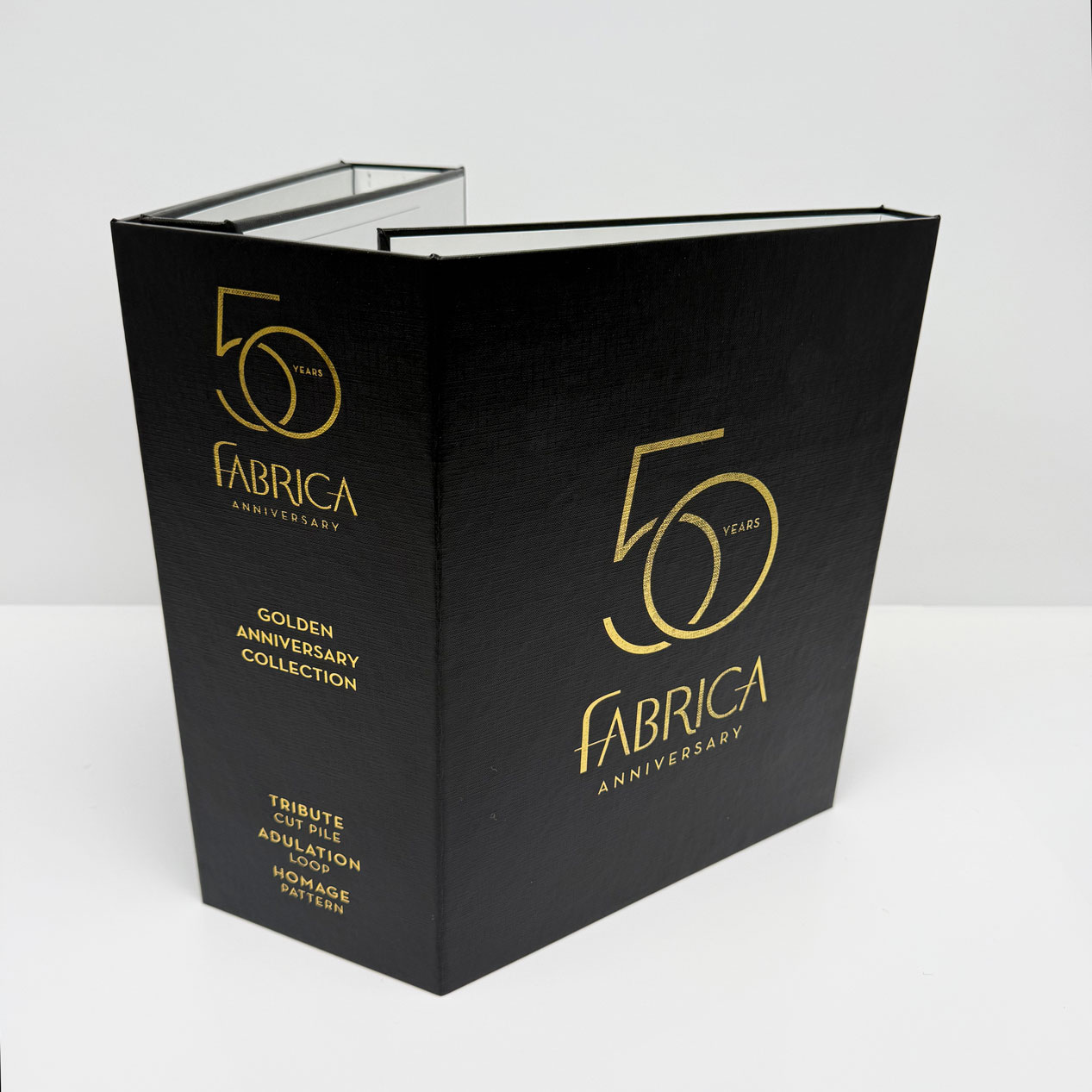 Black Fabrica 50 Years Golden Anniversary Collection book with gold lettering on cover and spine.