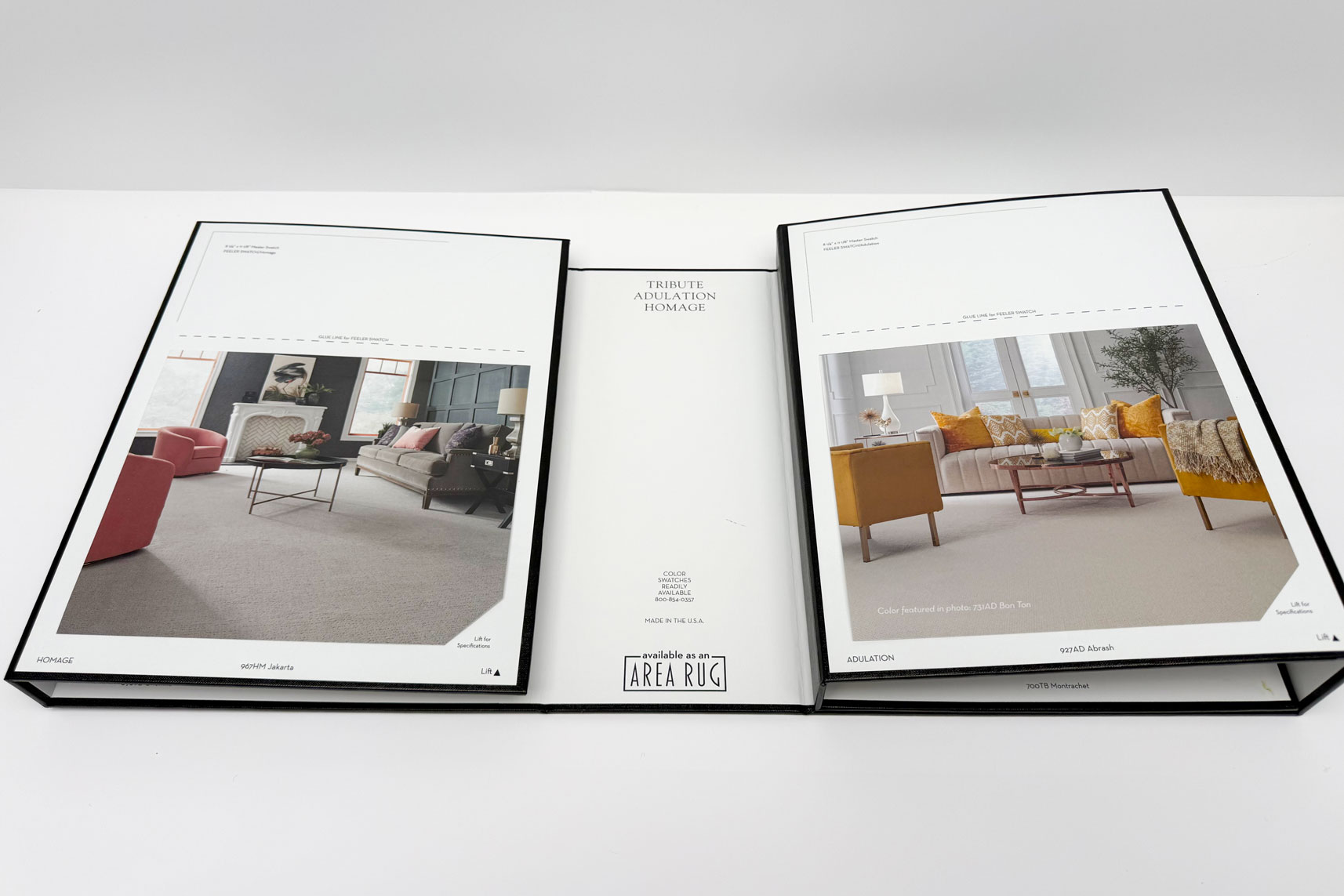 Open carpet sample book showing two room setups with rugs named Homage and Adulation.