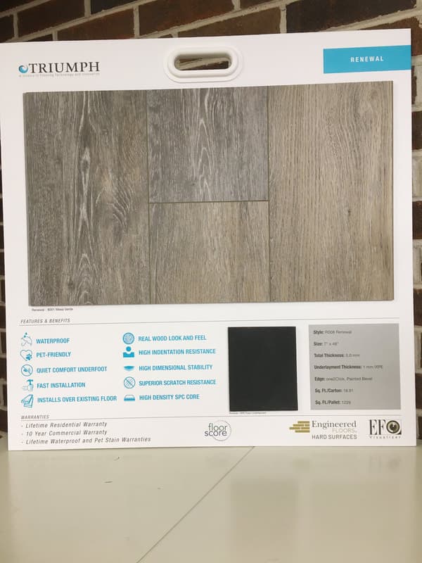 Sample card showing Triumph Renewal waterproof, pet-friendly, wood-look flooring with features and specs.