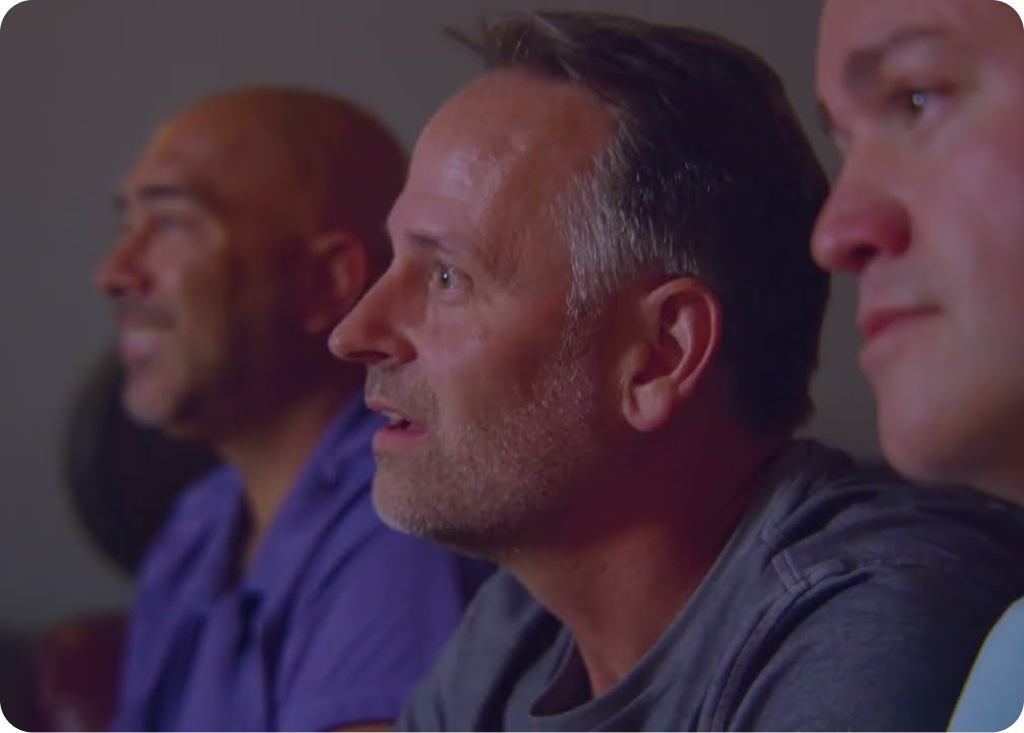 A visual representation of a home theater setup with seating and screen.