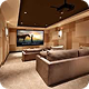 Home theater room with large screen, two brown sofas, and warm lighting.