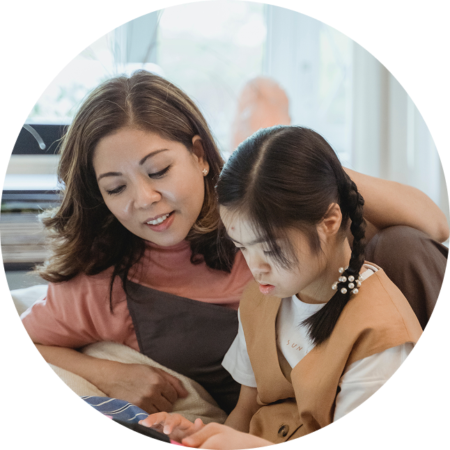 Mother helping daughter with her work