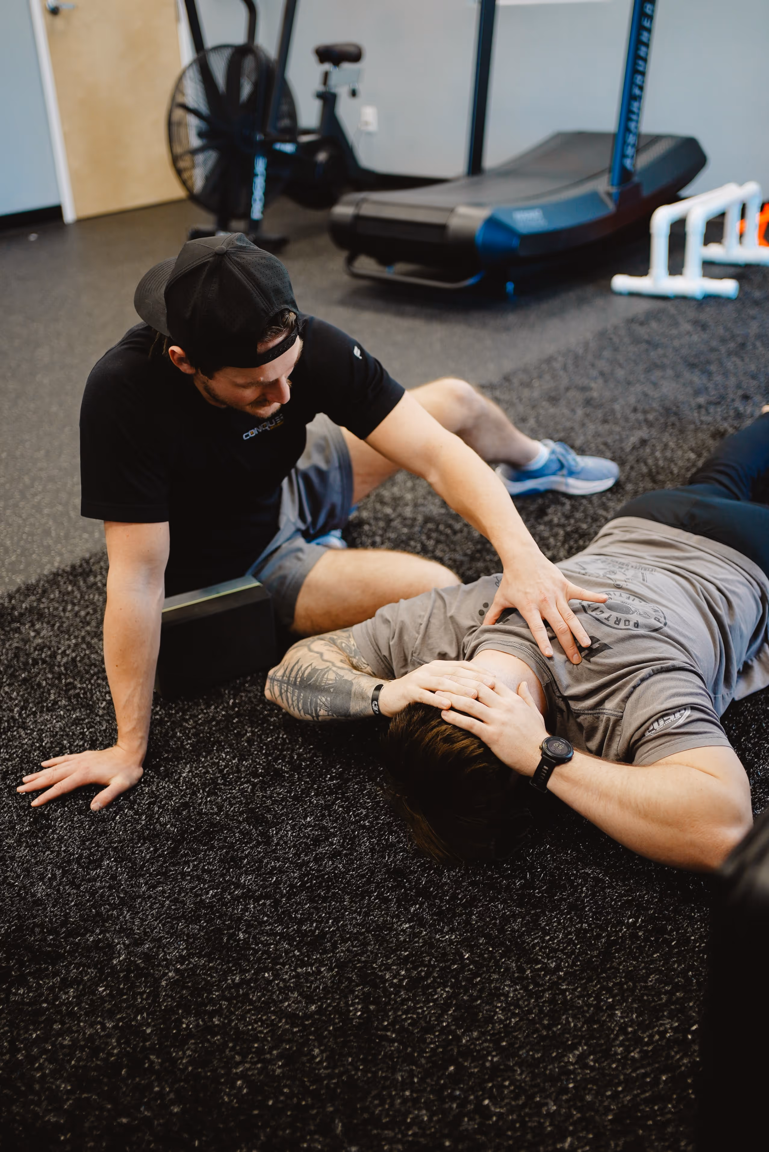 Doctor of physical therapy performing spinal assessment and movement analysis in Wilmington