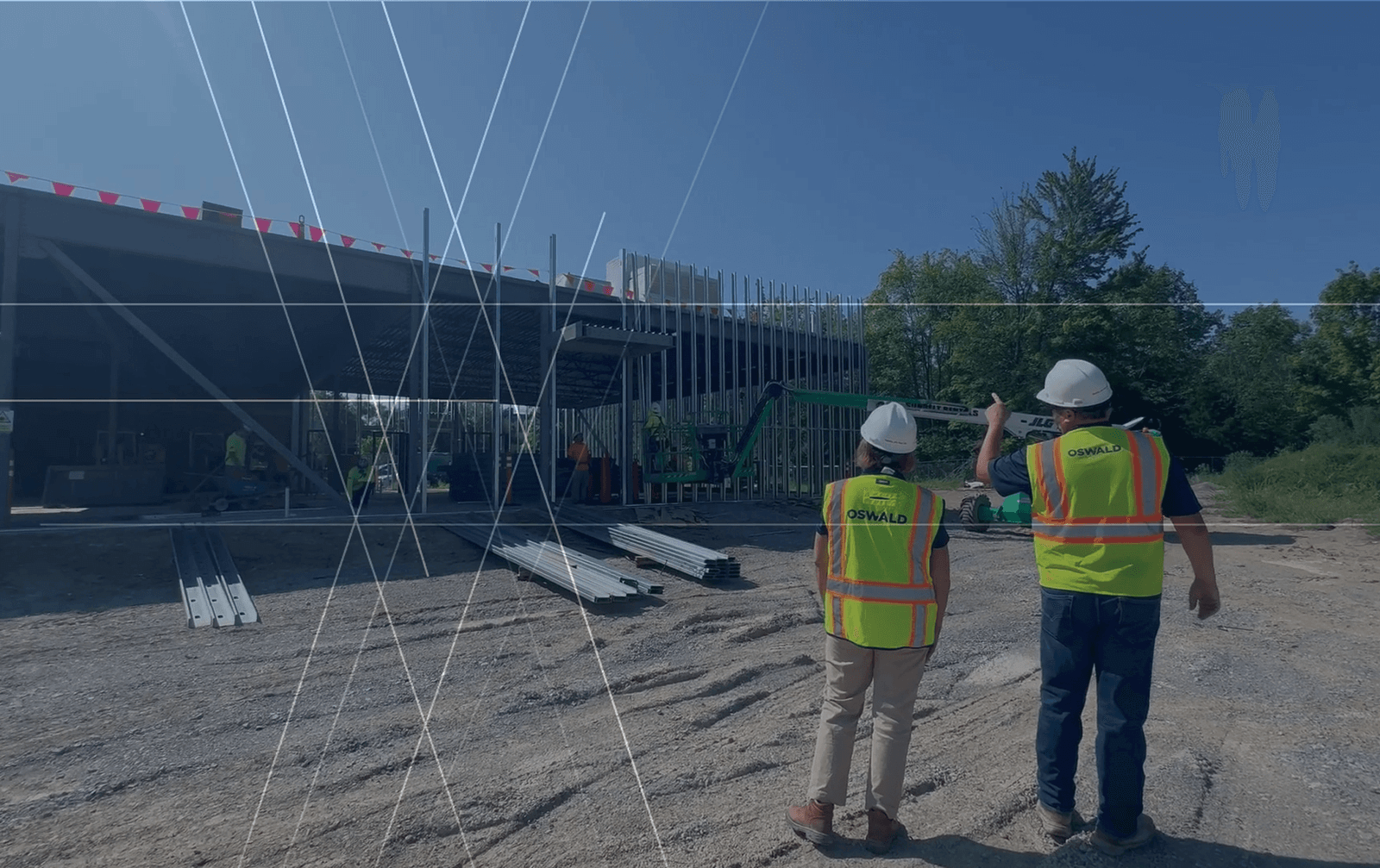 Two Oswald employees at in-progress construction site.
