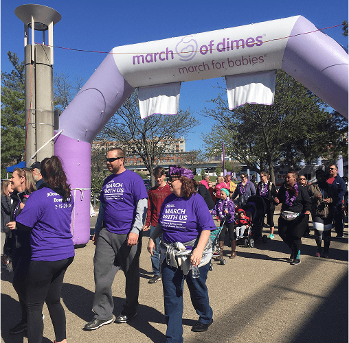 People walking at a volunteer event.