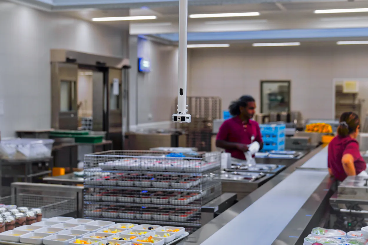 [interface] image of ai software on a tablet with hospital setting background (for an ai healthcare company)