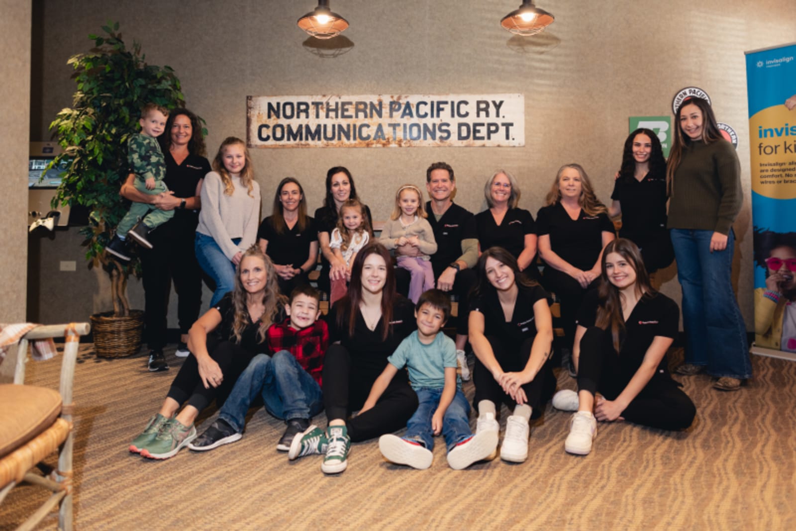 Pediatric Dental Center of North Idaho team standing together outside brick building