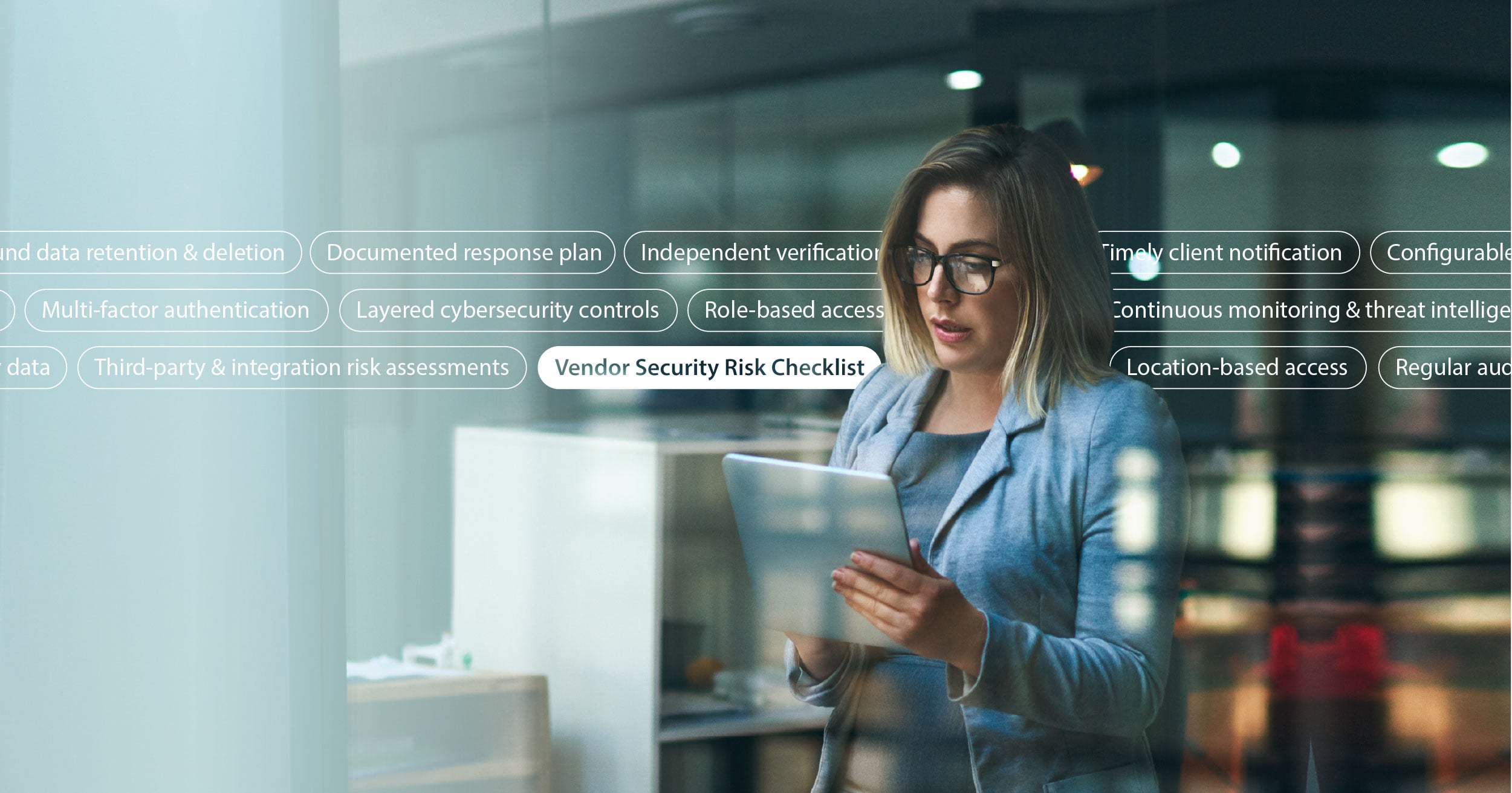 Woman in a blue blazer holding a tablet with overlaid cybersecurity and risk checklist terms.