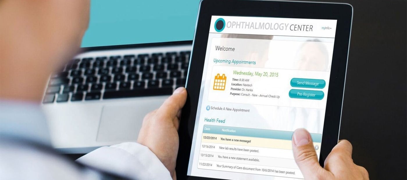 Person holding a tablet displaying an ophthalmology app with appointments and health notifications.