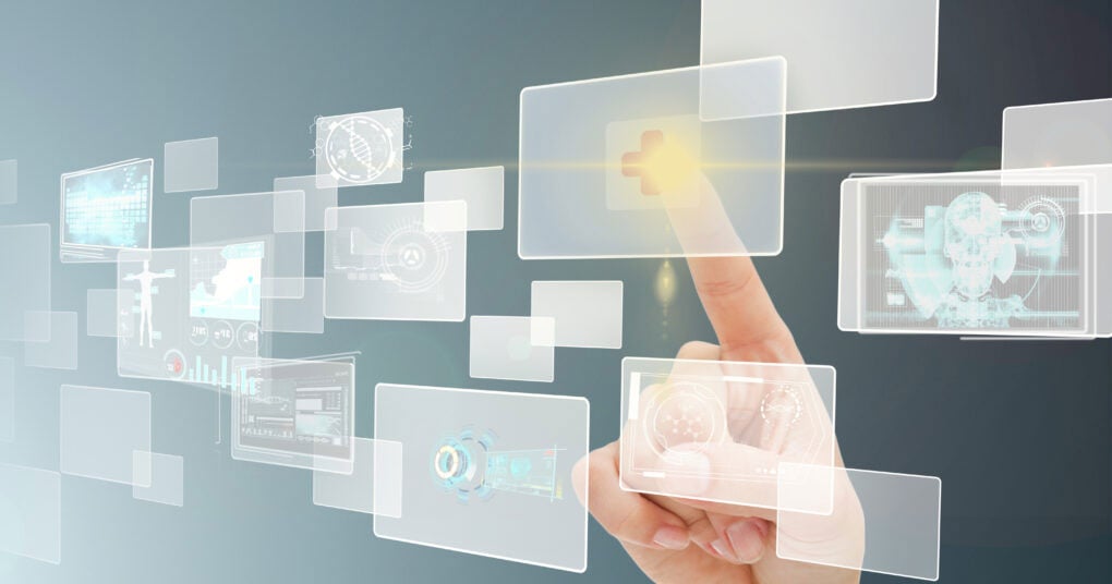 Finger touching a floating transparent touchscreen icon with medical data and digital interface elements.