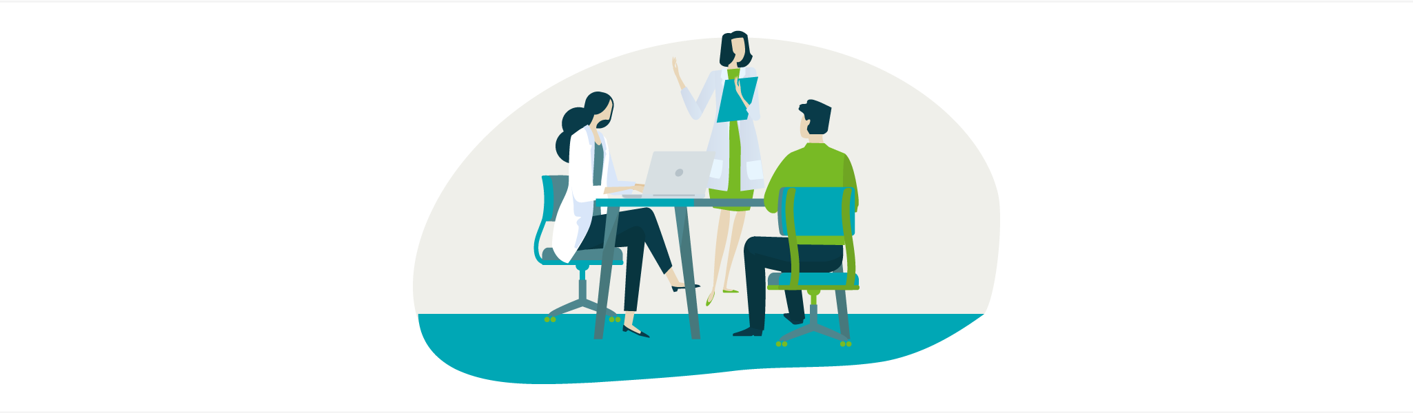 Three people in a meeting: two seated at a table with a laptop, one standing and speaking with a clipboard.
