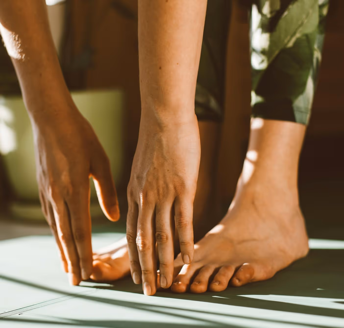 Ankle impingement and instability treated with minimally invasive arthroscopy in Los Angeles, close-up of feet and hands.