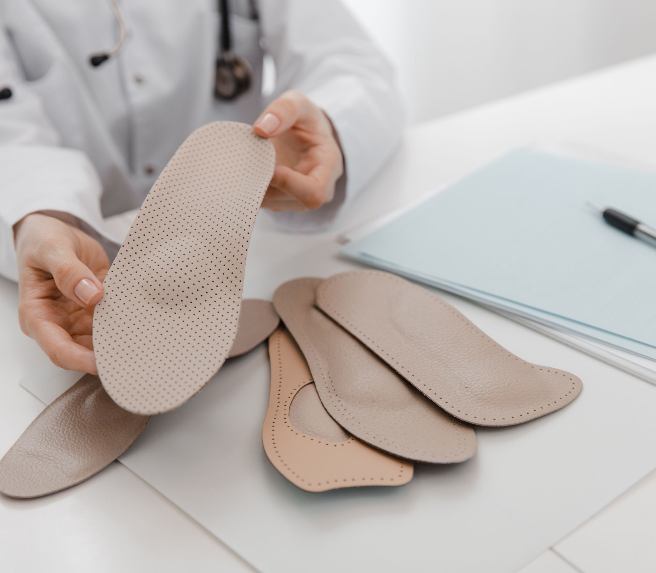 Doctor in Los Angeles discusses shin splint treatment with custom orthotics, activity modification, and supportive care.