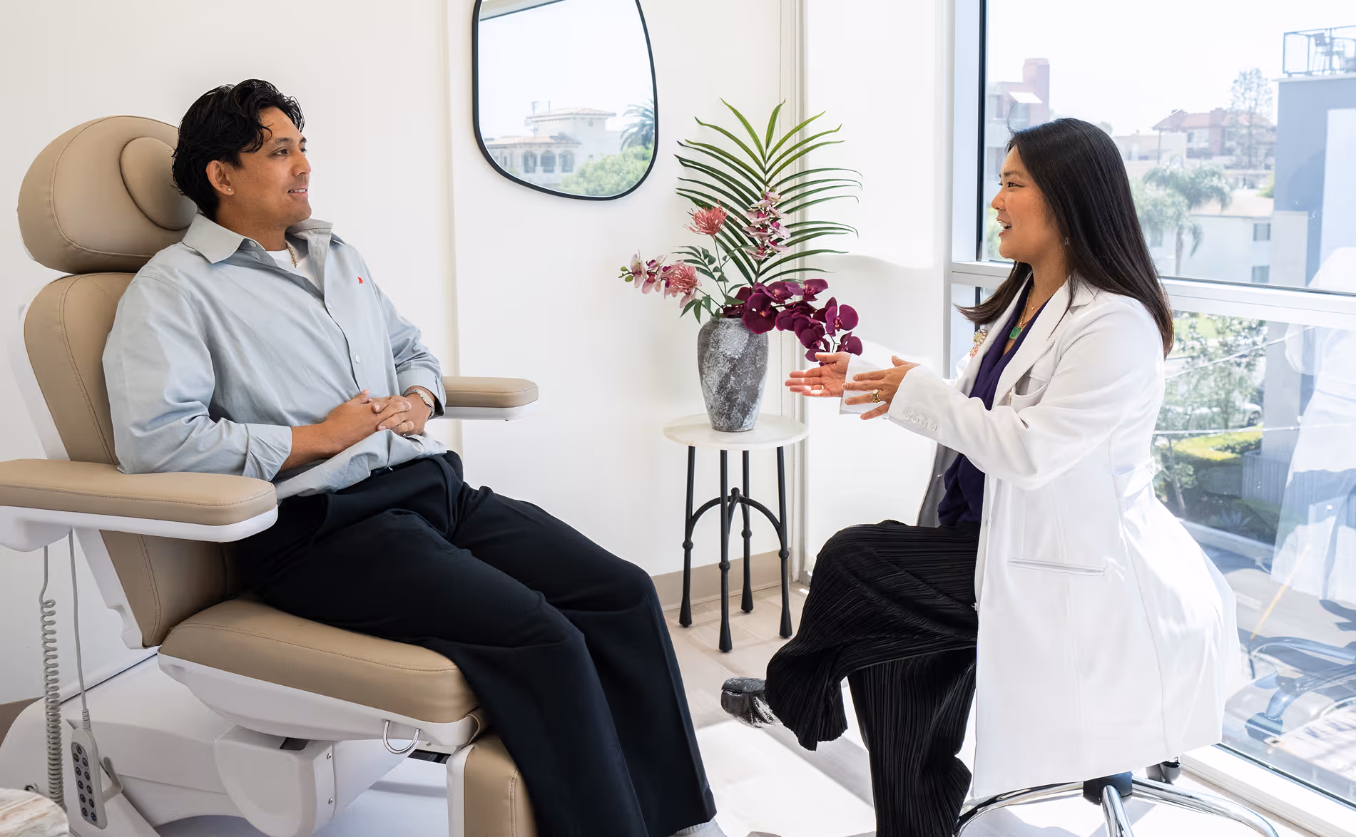 Dr. Megan Ishibashi of KIN Foot & Ankle meeting with a patient