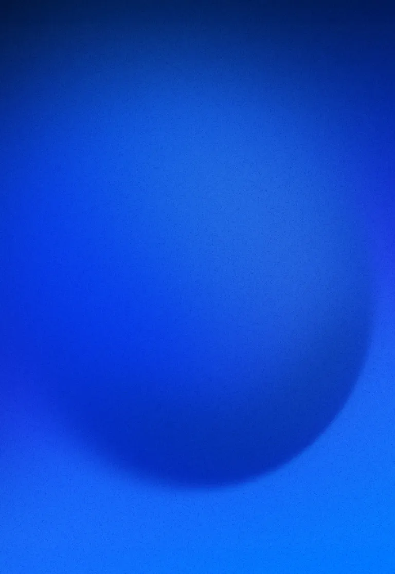 Abstract gradient background featuring a large soft-edged dark blue circle on a vibrant blue surface.
