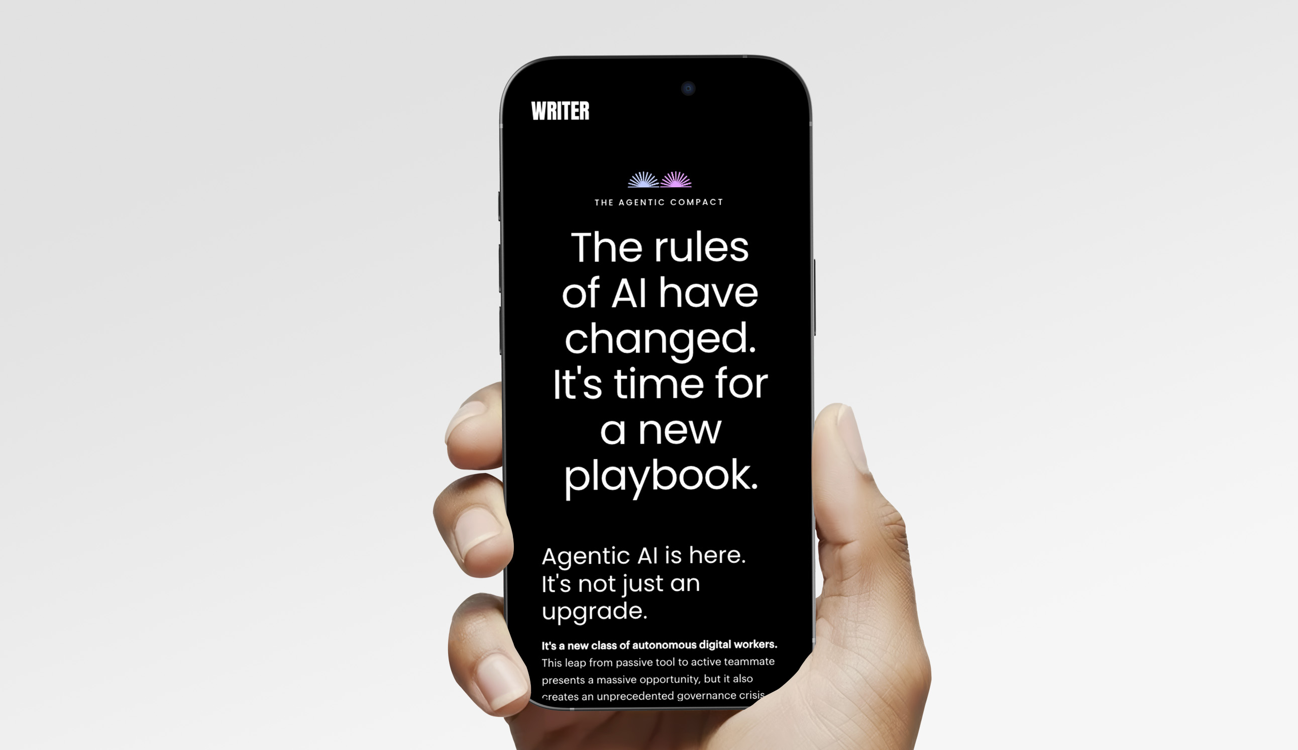 Hand holding a smartphone displaying text about new rules for AI and the arrival of Agentic AI as a new class of autonomous digital workers.