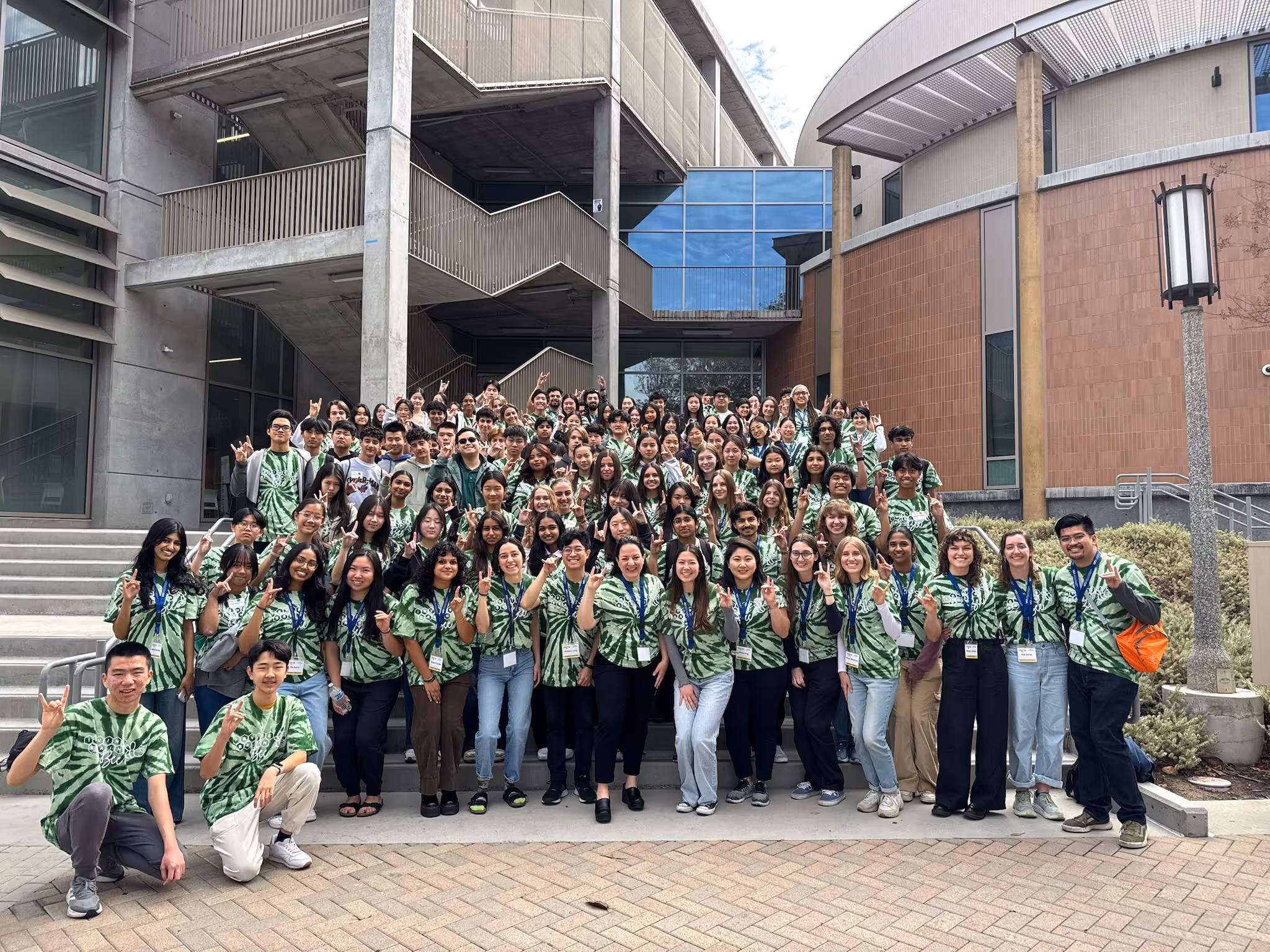 High school Brain Bee competition participants in matching green tie-dye shirts at UC Irvine