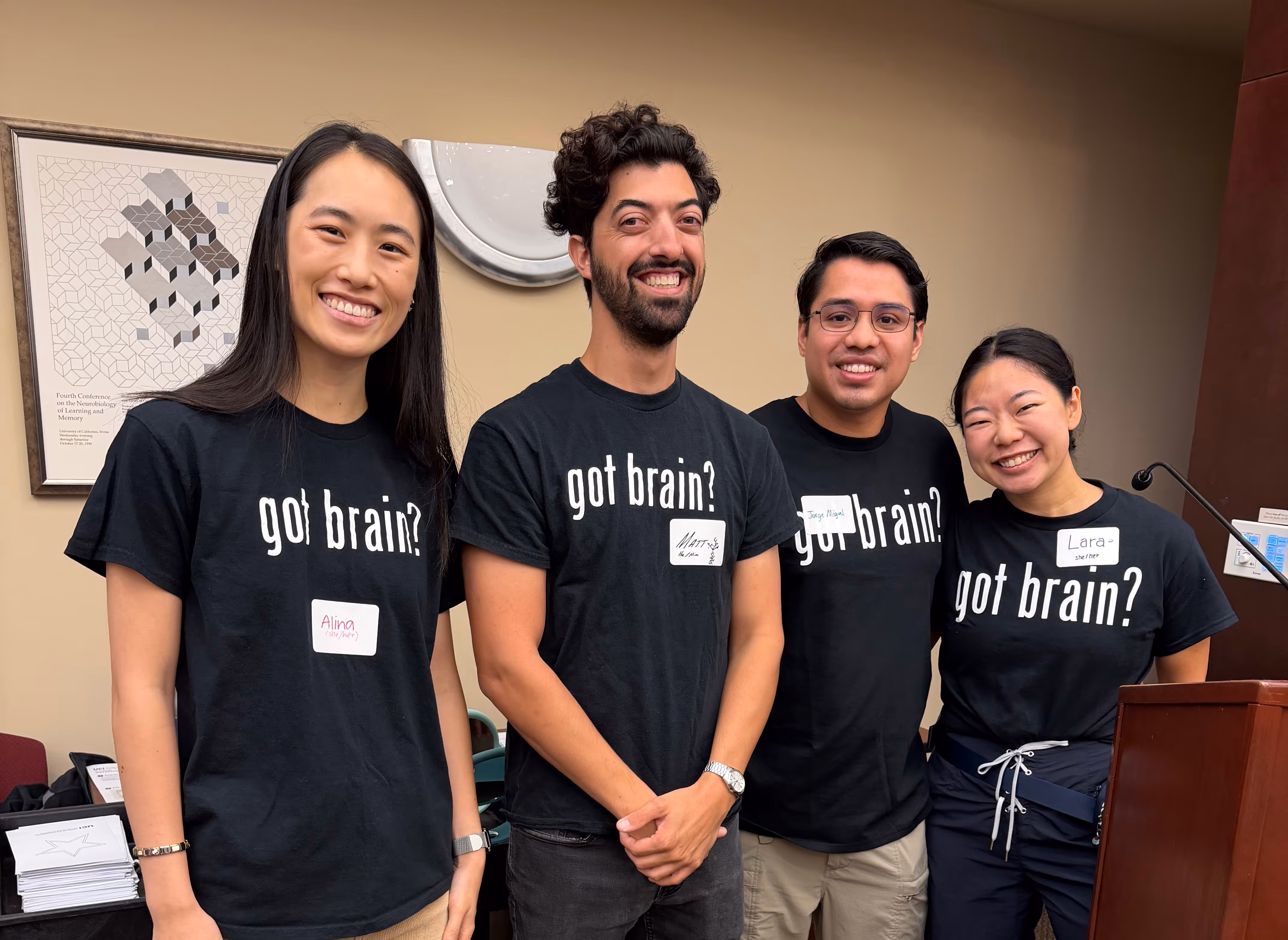 Four NeuroEngage team members wearing "got brain?" shirts at neuroscience outreach event