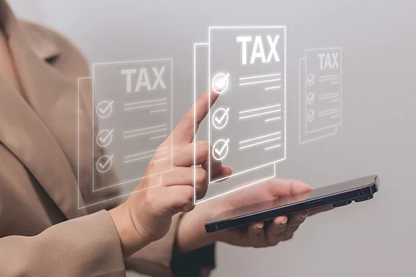 businesswoman reviewing tax information on phone