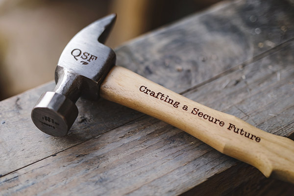 QSF Crafting a secure child's future - hammer with a wooden handle